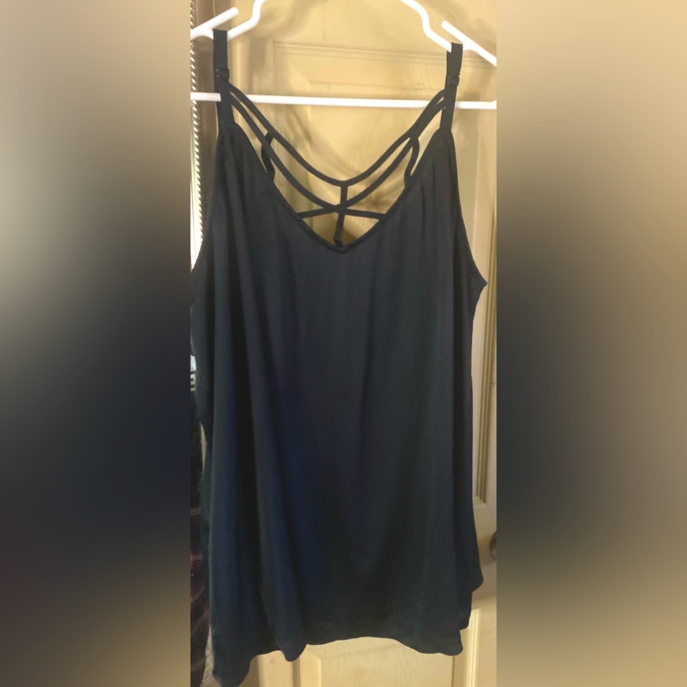 Torrid size 3x, satiny material, crisscross over the chest design.